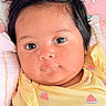 Estefany joined the competition — help win amazing prizes! baby, infant, face, eyes, hair, yellow_clothing, watermelon_print, cute, portrait, closeup, child, newborn, soft_toys, pink_background, lying_down, skin, young_child, adorable, peaceful, indoors