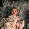 baby, child, infant, portrait, lying_down, blanket, pink, gray, plaid, fluffy, bed, indoors, sneakers, shoes, clothing, wide_eyes, looking_at_camera, cozy, cute, photography