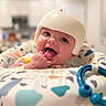 Serenity joined the competition — help win amazing prizes! baby, infant, child, helmet, smiling, portrait, face, eyes, tongue, hand, finger, indoor, nursery, bedding, blanket, crib, toy, colorful, close_up, happy