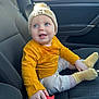 Oaklyn-Jay is registered to the contest to win money with this photo: baby, child, car_interior, car_seat, seatbelt, yellow_clothing, knitted_hat, lion_king, blue_eyes, smiling, cute, sitting, infant, happy, child_in_car, clothing, hand, footwear, seat, car_door