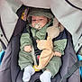 baby, stroller, pacifier, plush_toy, green_jacket, white_socks, infant, child, seatbelt, car_seat, hood, cute, outdoor, person, small_hands, soft_toy, comfort, resting, casual_clothing, infant_care