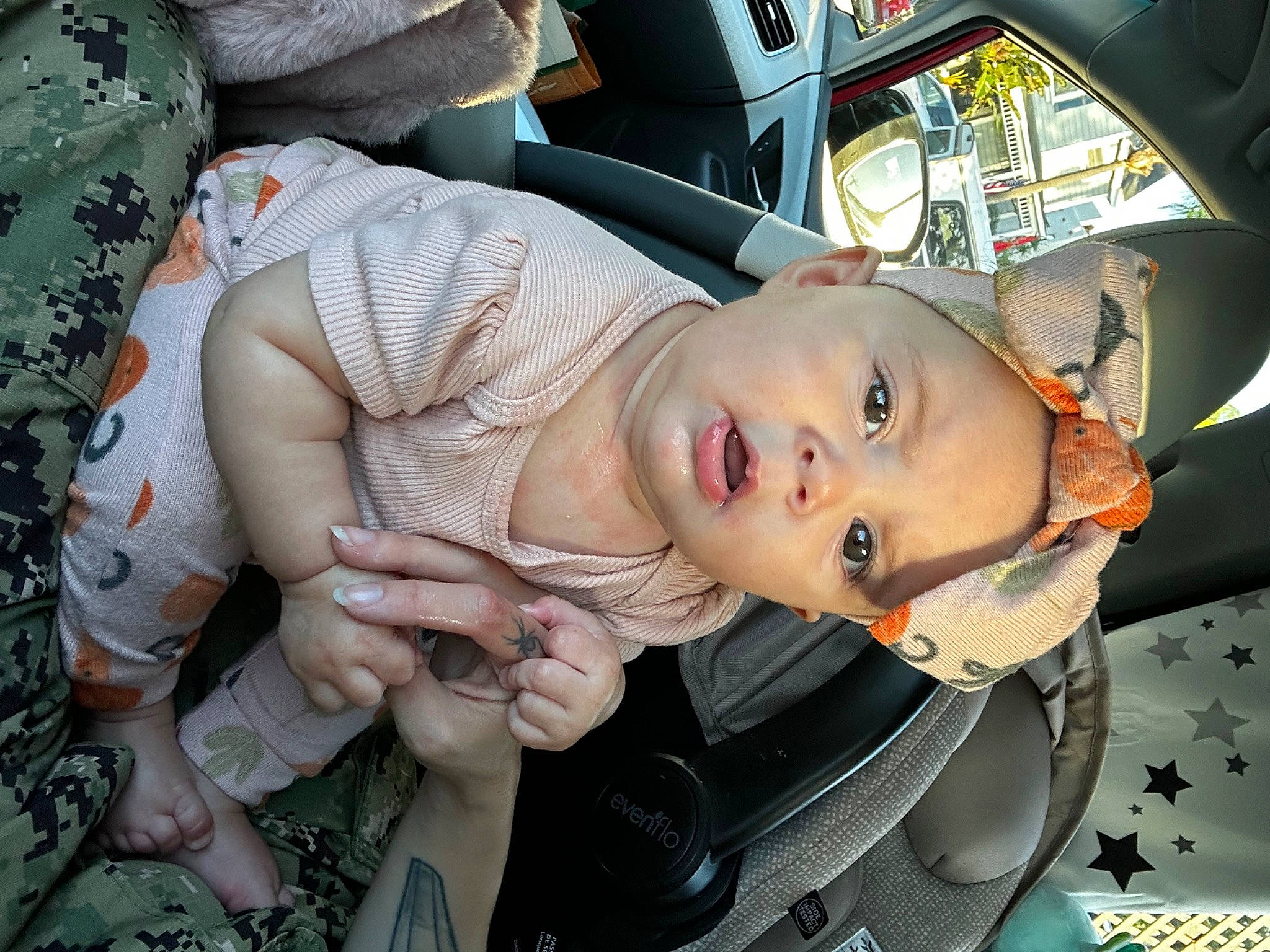 Athena is registered to the contest to win money with this photo: auto_part, automotive_design, automotive_exterior, automotive_lighting, automotive_wheel_system, baby, baby_carriage, bumper, car_seat, child, eyewear, family_car, hat, motor_vehicle, person, toddler, tree, trunk, vehicle, vehicle_door