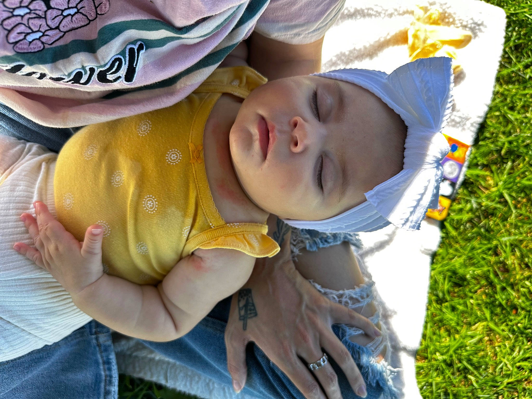 Athena is registered to the contest to win money with this photo: baby, baby_products, baby_toddler_clothing, child, clothing, comfort, eye, finger, fun, grass, hand, happy, hat, headwear, pattern, people_in_nature, person, smile, sun_hat, thumb