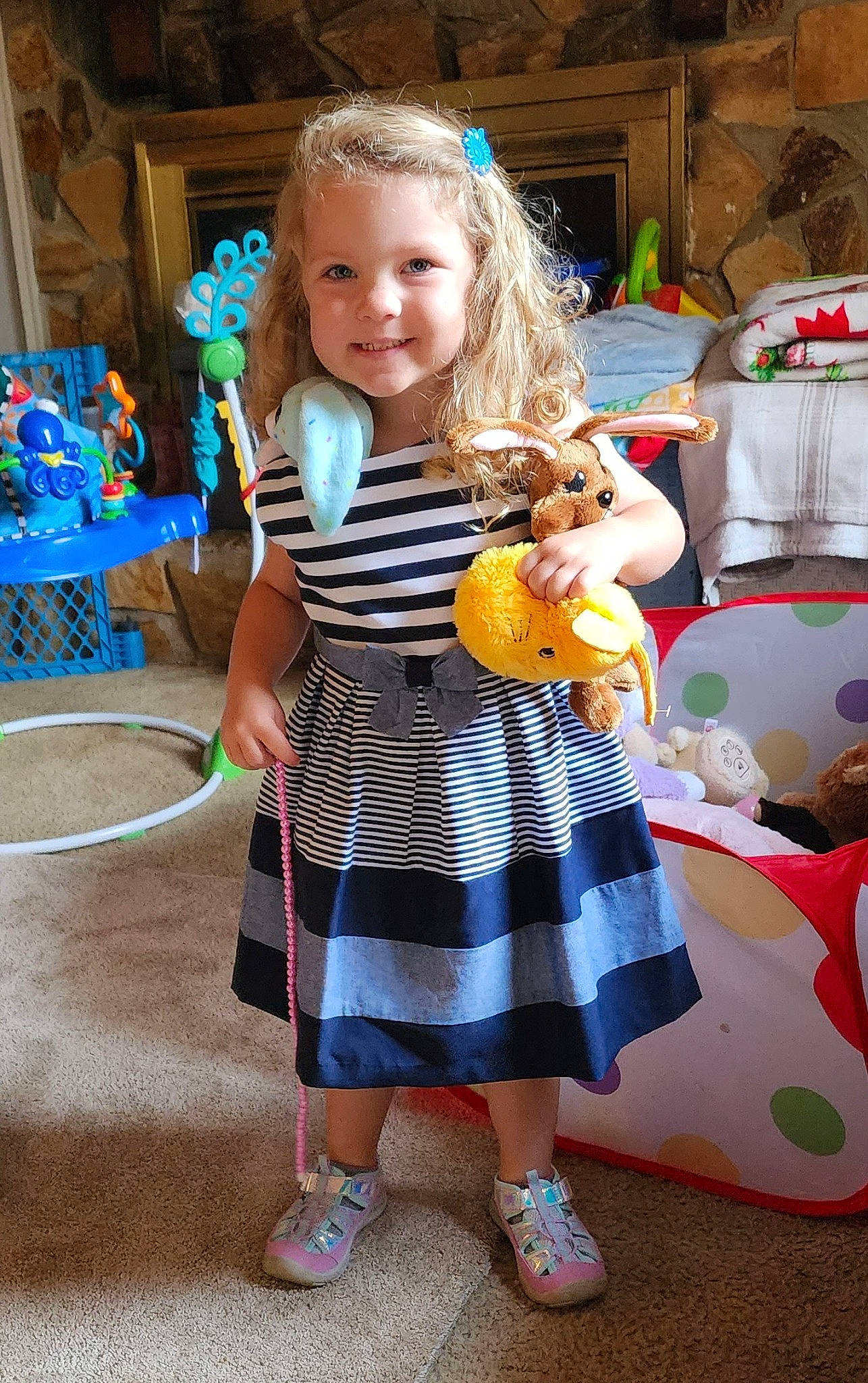 Amelia is registered to the contest to win money with this photo: blue, child, dress, event, fun, hairstyle, happy, joy, leisure, musical_instrument, party, pattern, person, play, sandal, shoe, smile, summer, textile, toddler