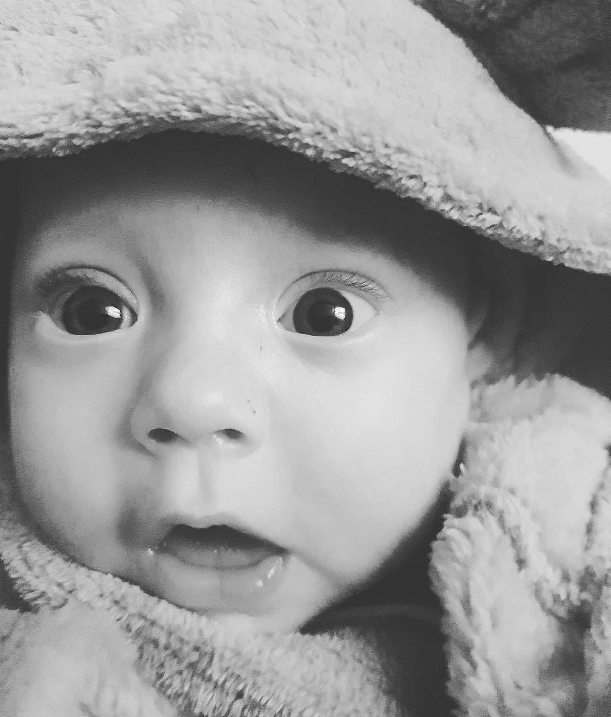 Logan'James is registered to the contest to win money with this photo: beauty, black, black_and_white, cheek, child, close_up, eye, eyebrow, face, head, headwear, infant, lip, monochrome_photography, mouth, nose, person, photograph, photography, skin