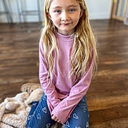 Mckenna joined the competition — help win amazing prizes! child, girl, portrait, indoors, kneeling, smiling, blonde_hair, long_hair, pink_shirt, jeans, heart_pattern, blanket, wooden_floor, home, living_room, furniture, sitting, face, person, photography