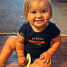 Xander joined the competition — help win amazing prizes! baby, child, toddler, smiling, portrait, indoor, sitting, wooden_floor, baseball_shirt, clothing, blond_hair, blue_eyes, face, hands, legs, happy, home, warm_lighting, photography, infant