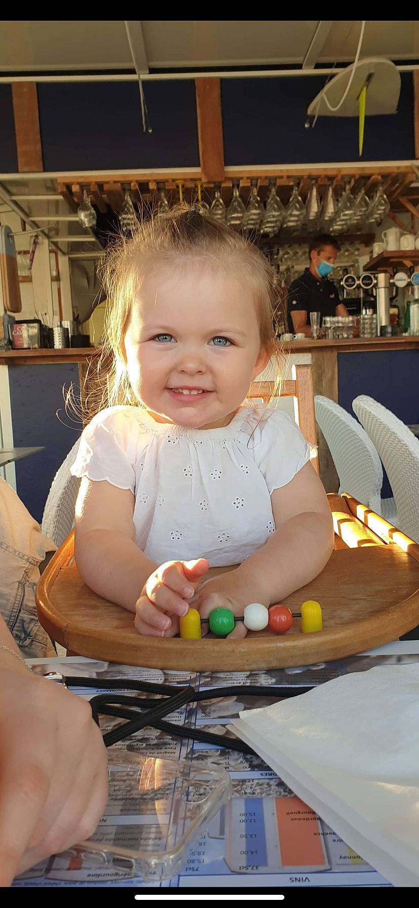 Sofia participe au concours pour gagner de l'argent avec cette photo : arm, baby, baby_toddler_clothing, blond, chair, cheek, child, dress, fun, hair, hairstyle, happy, iris, joy, leisure, person, recreation, sitting, skin, smile