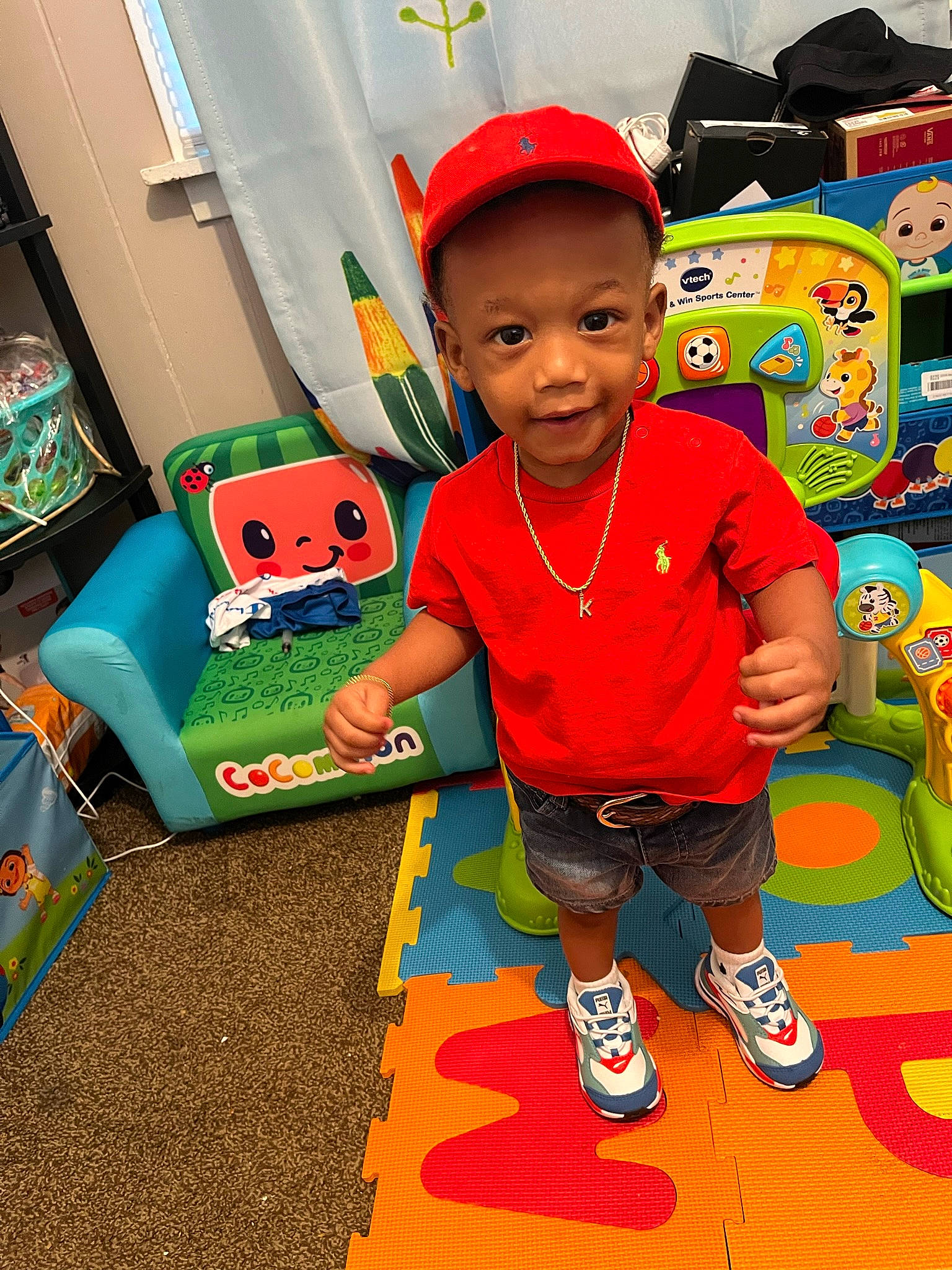 Keegan joined the competition — help win amazing prizes! baby, baby_toddler_clothing, baby_toys, baseball_cap, cap, child, flooring, fun, grass, hairstyle, happy, hat, joy, leisure, person, play, recreation, room, t_shirt, textile