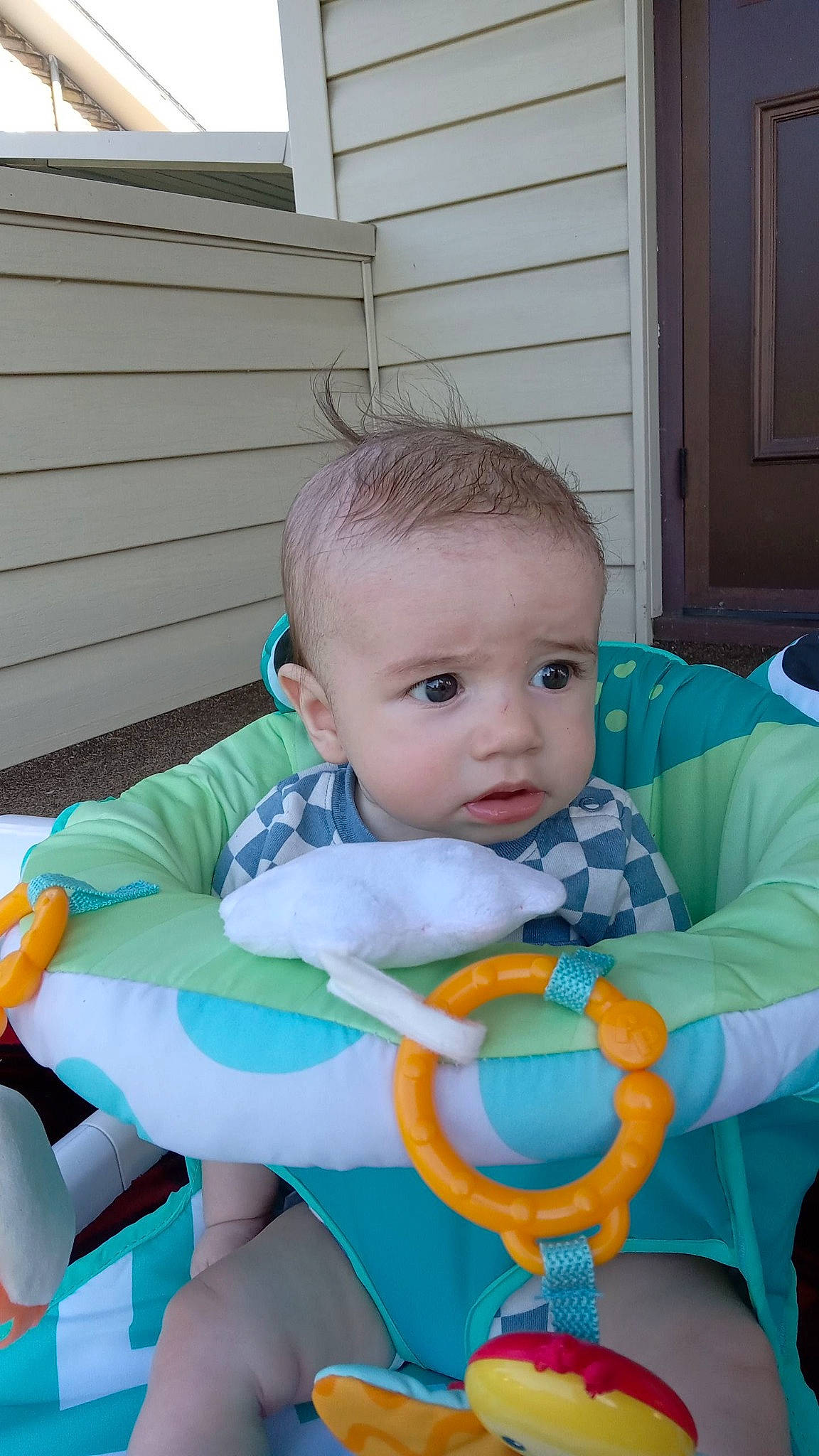 Kaius is registered to the contest to win money with this photo: baby, baby_carriage, baby_products, baby_safety, baby_toddler_clothing, bib, chair, cheek, child, comfort, eye, fun, grass, head, iris, lap, person, product, sitting, toddler