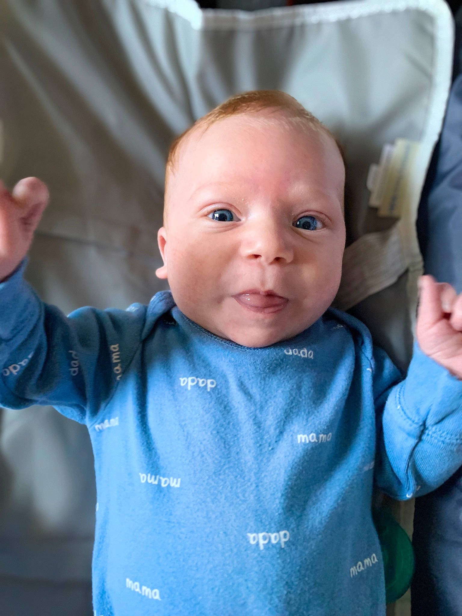 Greyson is registered to the contest to win money with this photo: arm, baby, baby_toddler_clothing, cheek, chin, eye, eyebrow, face, facial_expression, hairstyle, hand, happy, head, human, neck, nose, person, skin, sleeve, smile