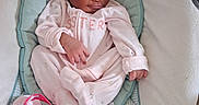 Amari joined the competition — help win amazing prizes! baby, infant, onesie, pacifier, baby_seat, sleeping, cushion, cloth, cute, child, indoors, resting, newborn, soft, small, person, comfort, peaceful, pink, sleep