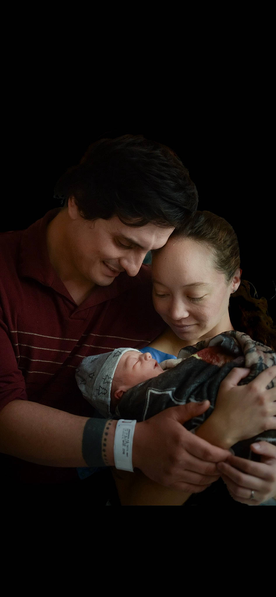 Garret is registered to the contest to win money with this photo: arm, baby, child, darkness, elbow, event, flash_photography, fun, gesture, hand, happy, hug, jewellery, joy, love, nail, person, sitting, smile, t_shirt