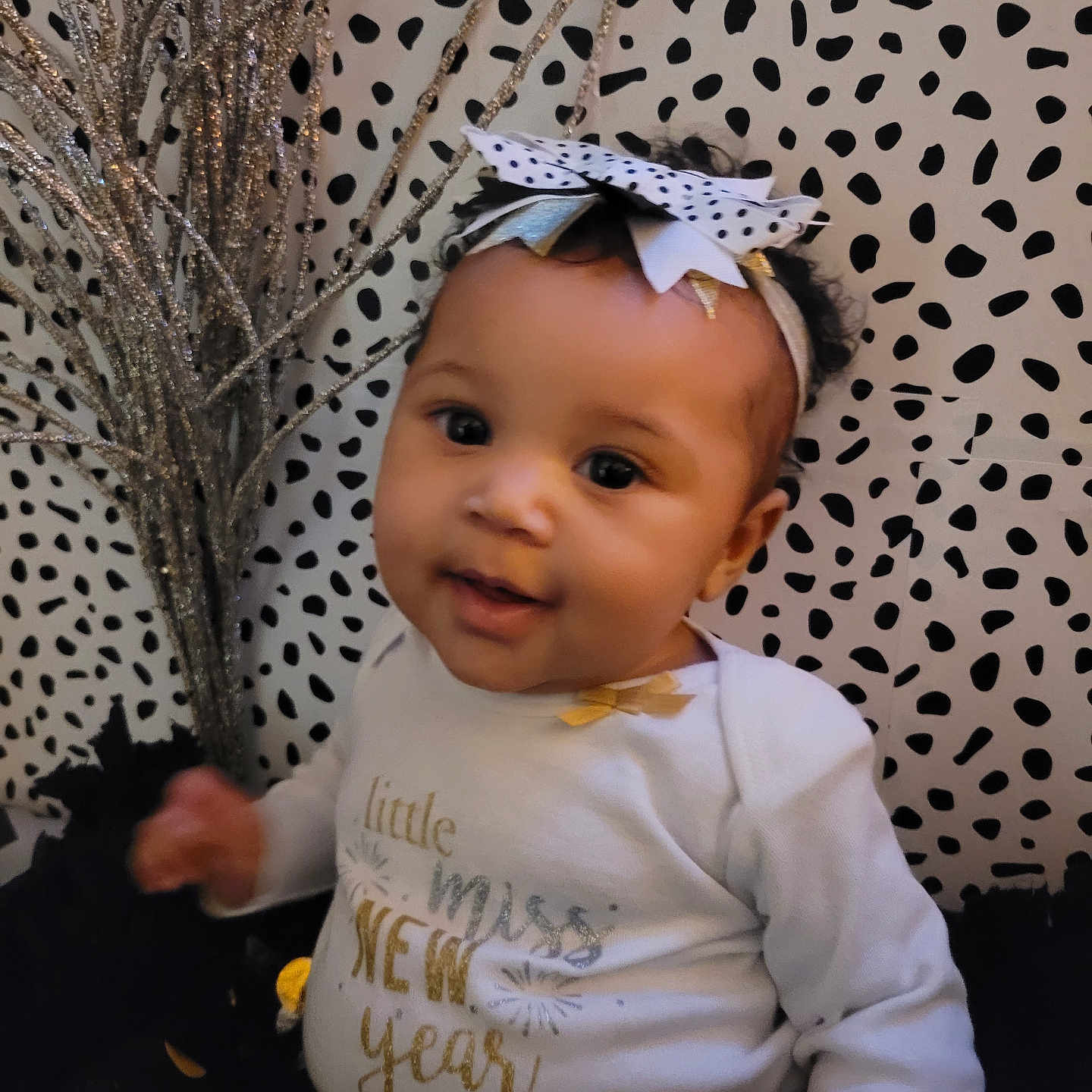 Haven is registered to the contest to win money with this photo: accessories, baby, bodypart, clothing, face, finger, hand, happy, hat, head, headband, jewelry, longsleeve, pattern, person, photography, portrait, sitting, sleeve, smile