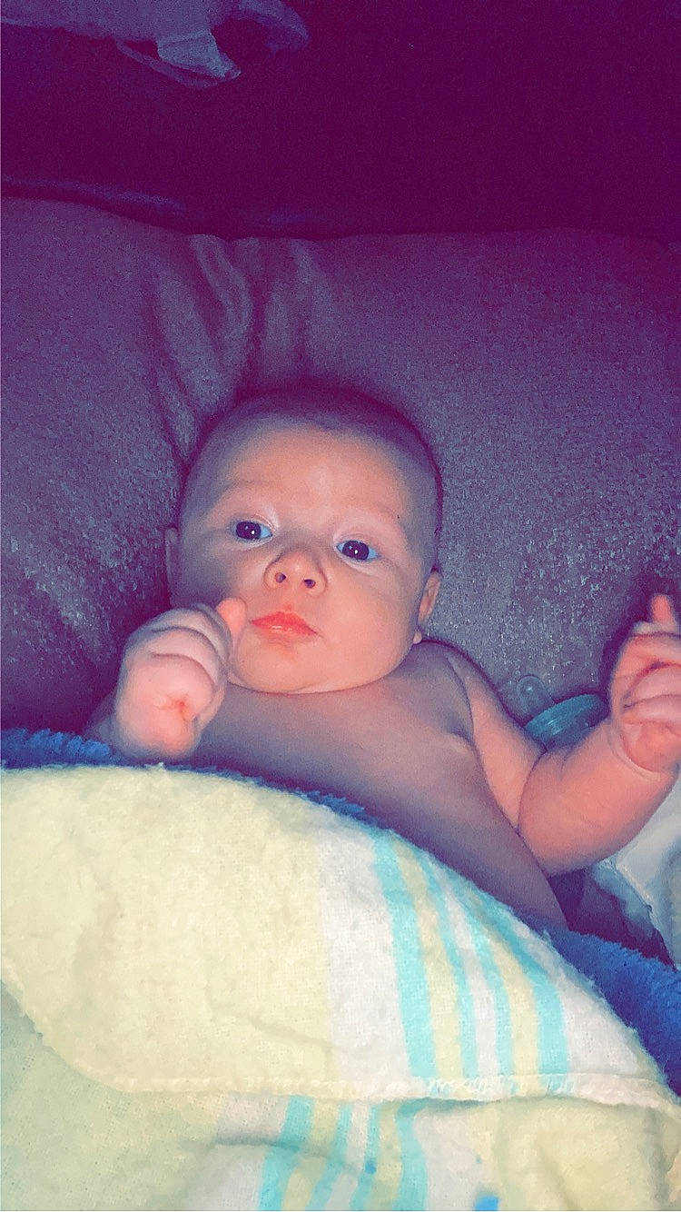 Kylo is registered to the contest to win money with this photo: arm, baby, baby_toddler_clothing, cheek, chin, comfort, eye, eyebrow, finger, flash_photography, head, human_body, iris, lip, mouth, neck, nose, person, skin, stomach