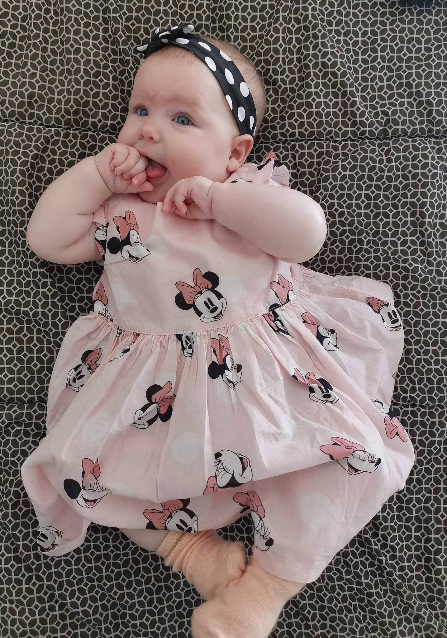 Lycia participe au concours pour gagner de l'argent avec cette photo : baby, baby_bloomers, baby_products, baby_toddler_clothing, cheek, child, dress, head, headgear, outerwear, pattern, person, pink, product, sleeve, toddler