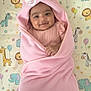 baby, pink_blanket, bunny_ears, smiling, infant, cute, animal_print, lion, giraffe, elephant, zebra, child, soft_texture, wrapped, lying_down, happy, indoors, pastel_colors, toddler, blanket