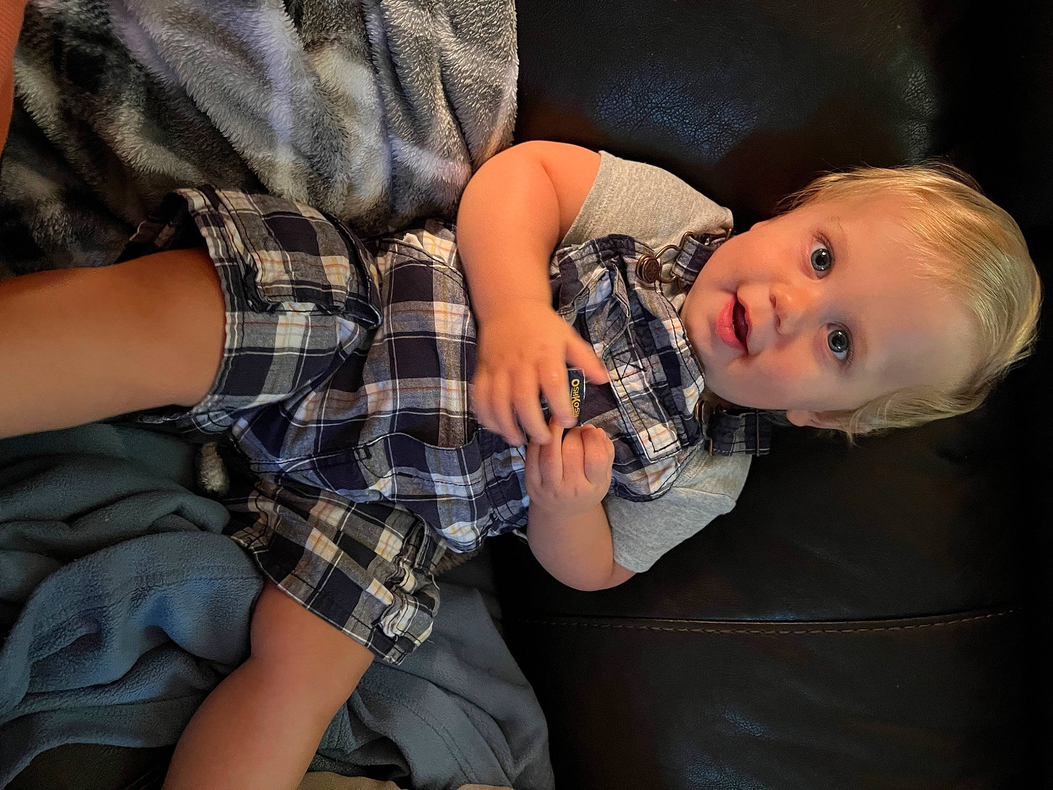 Beckham is registered to the contest to win money with this photo: baby, child, comfort, elbow, finger, flash_photography, gesture, hand, human_leg, nail, pattern, person, plaid, sitting, sleeve, tartan, textile, thigh, toddler, tree