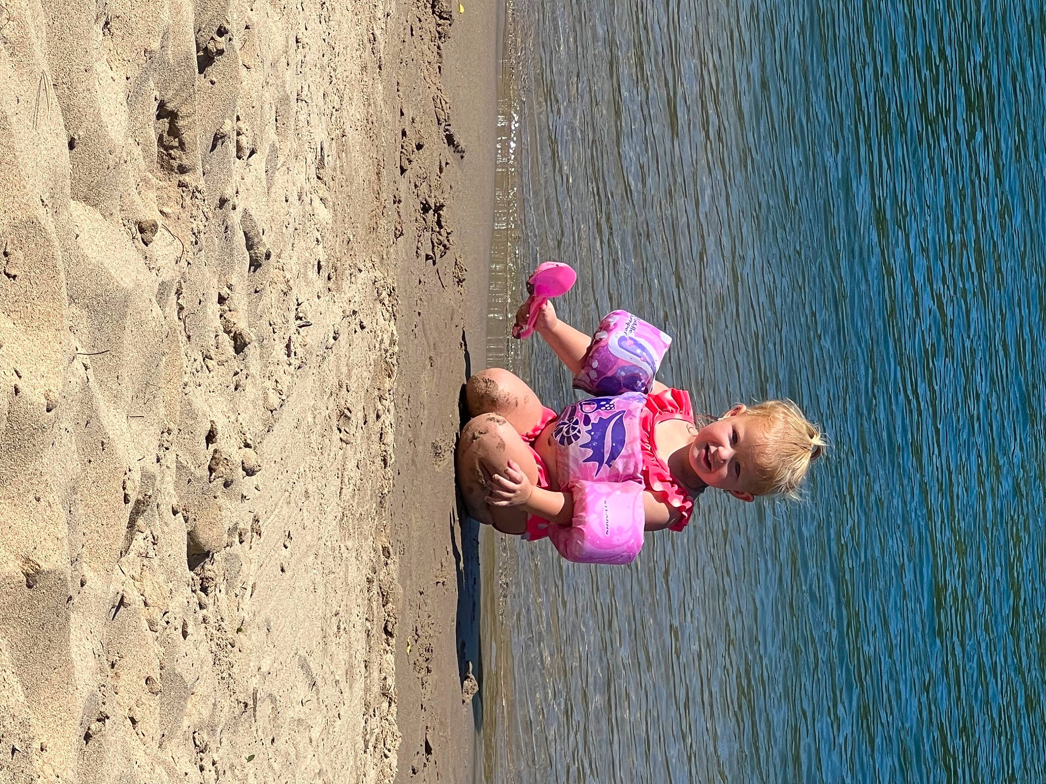 Payton Lee is registered to the contest to win money with this photo: adventure, beach, boats_and_boating_equipment_and_supplies, child, coast, elbow, extreme_sport, fun, happy, joy, lake, leisure, people_in_nature, person, plant, play, recreation, sport_climbing, sports, toddler