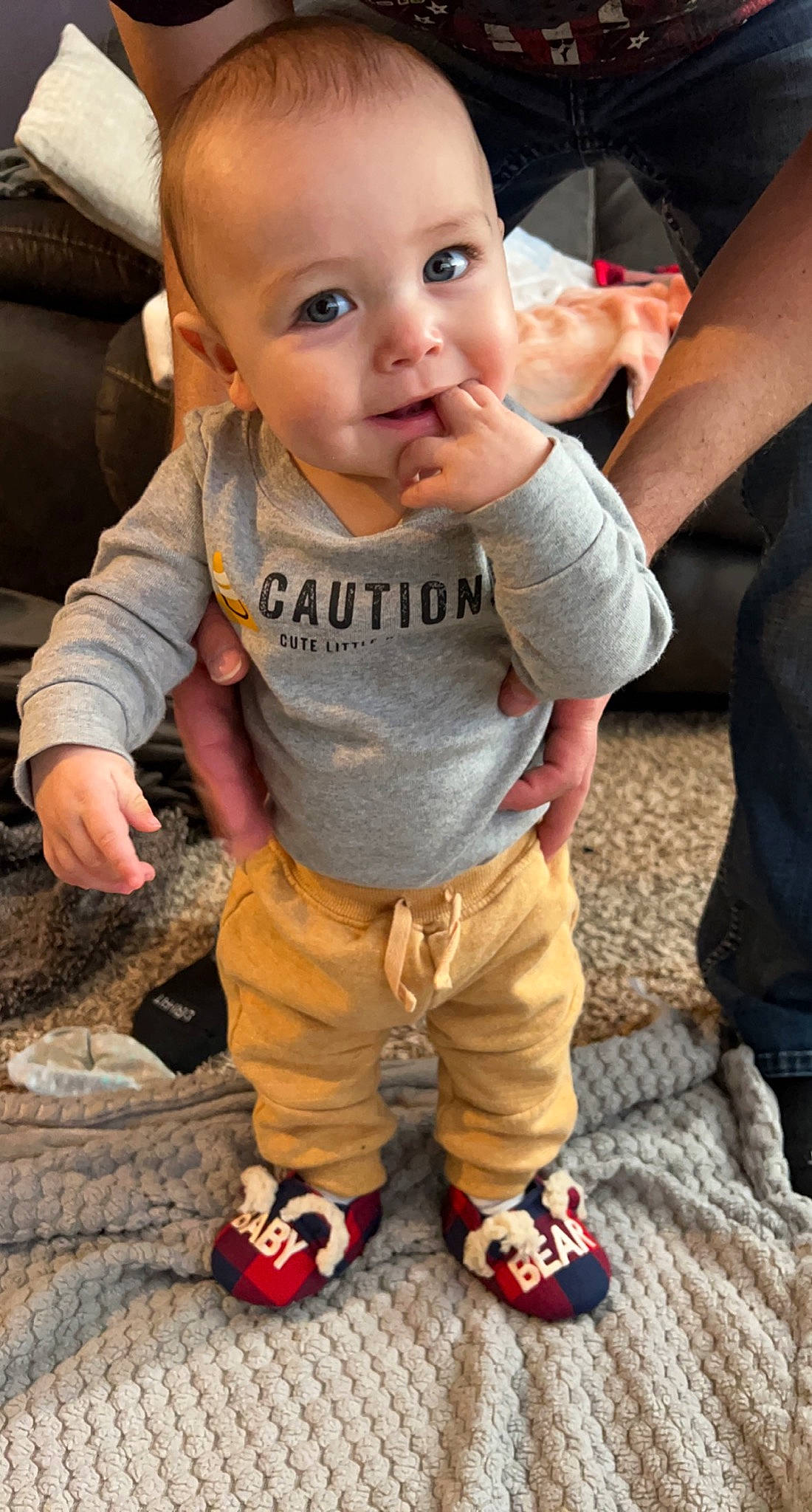 Mateo is registered to the contest to win money with this photo: arm, baby, baby_toddler_clothing, cheek, cool, facial_expression, finger, gesture, hand, happy, head, joint, leg, mammal, nose, person, photograph, skin, sleeve, standing