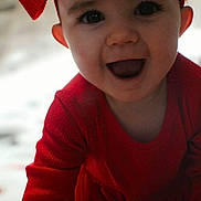 Piper Yost joined the competition — help win amazing prizes! baby, child, red_clothing, red_bow, smiling, happy, face, cute, infant, portrait, indoors, crawling, headwear, long_sleeve, human, closeup, young_child, expression, bright, cheerful