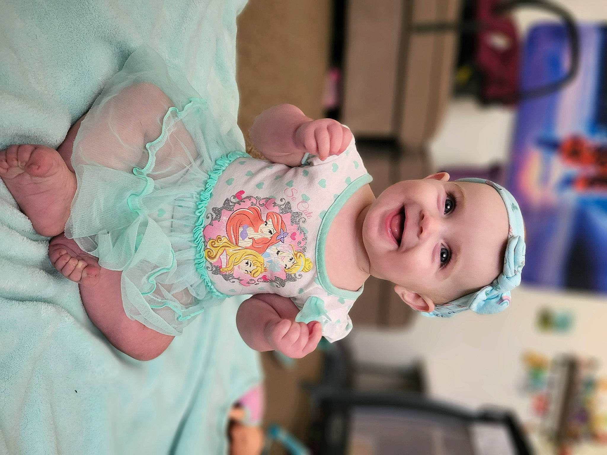 Zellatris is registered to the contest to win money with this photo: arm, baby, baby_toddler_clothing, cheek, child, dress, event, eye, facial_expression, finger, hand, happy, headwear, human_body, joy, mammal, mouth, person, pink, skin