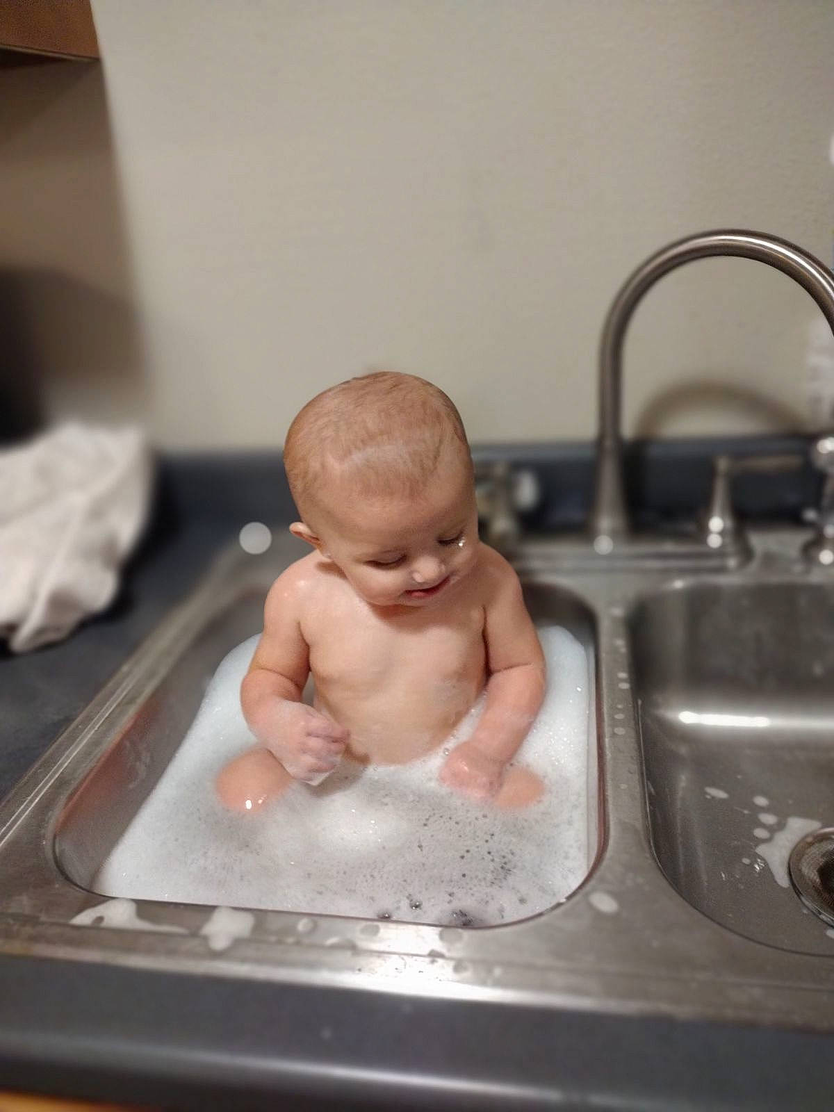 Wrenlea joined the competition — help win amazing prizes! baby, baby_bathing, bathing, bathroom, bathroom_sink, ceramic, chest, fluid, gas, household_hardware, kitchen, kitchen_sink, metal, person, plumbing, plumbing_fixture, room, sink, tap, toddler