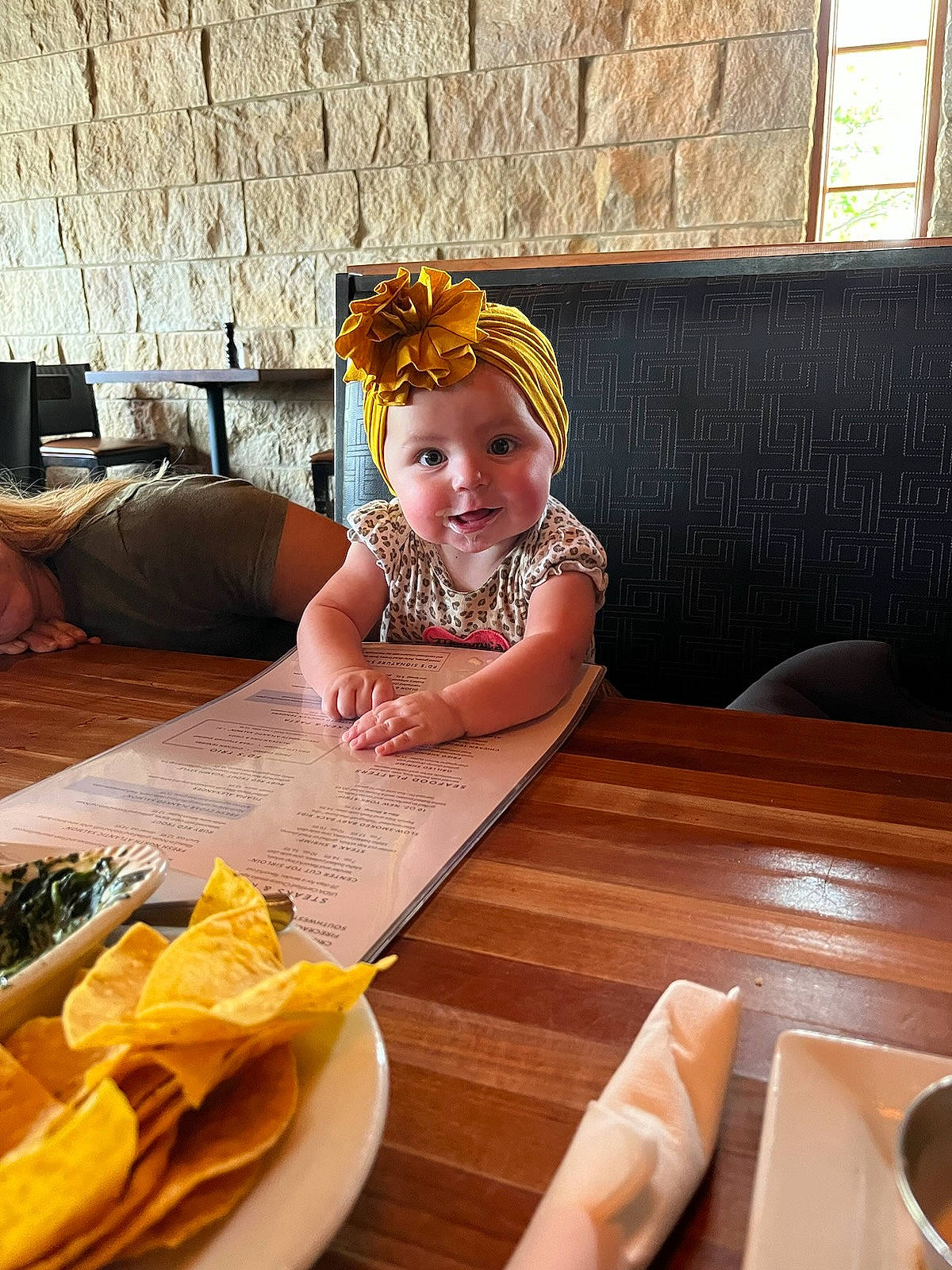 Wrenlea joined the competition — help win amazing prizes! baby, baby_toddler_clothing, chair, child, comfort, couch, dishware, floor, flooring, furniture, hardwood, headwear, kitchen_utensil, living_room, person, plate, smile, table, tableware, textile
