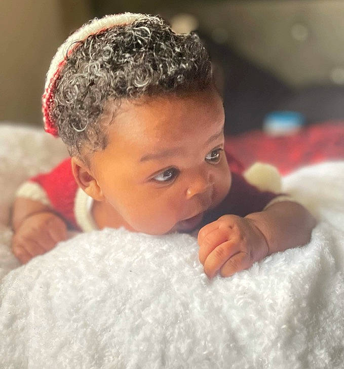 Ahmir is registered to the contest to win money with this photo: cheek, child, close_up, comfort, ear, eyebrow, eyelash, flash_photography, forehead, fun, fur, gesture, hairstyle, hand, happy, linens, nose, person, skin, thumb