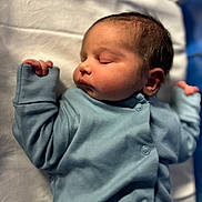 Nayel joined the competition — help win amazing prizes! newborn, baby, sleeping, infant, blue_onesie, blanket, soft_lighting, peaceful, cute, portrait, child, indoors, young_baby, sleep, face, hand, skin, head, cozy, rest