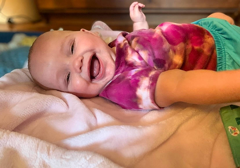 Echo joined the competition — help win amazing prizes! abdomen, baby, baby_toddler_clothing, cheek, comfort, eye, finger, fun, hair, happy, head, human_body, joy, linens, mouth, nose, person, purple, skin, smile