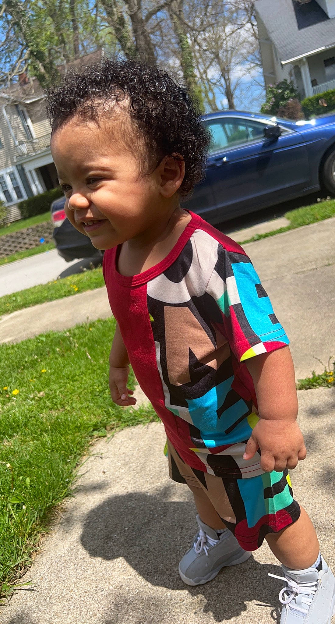 Jaxsyn joined the competition — help win amazing prizes! automotive_exterior, car, child, electric_blue, fun, garden, grass, happy, joy, leisure, pattern, person, plant, recreation, sidewalk, t_shirt, tire, toddler, tree, vacation