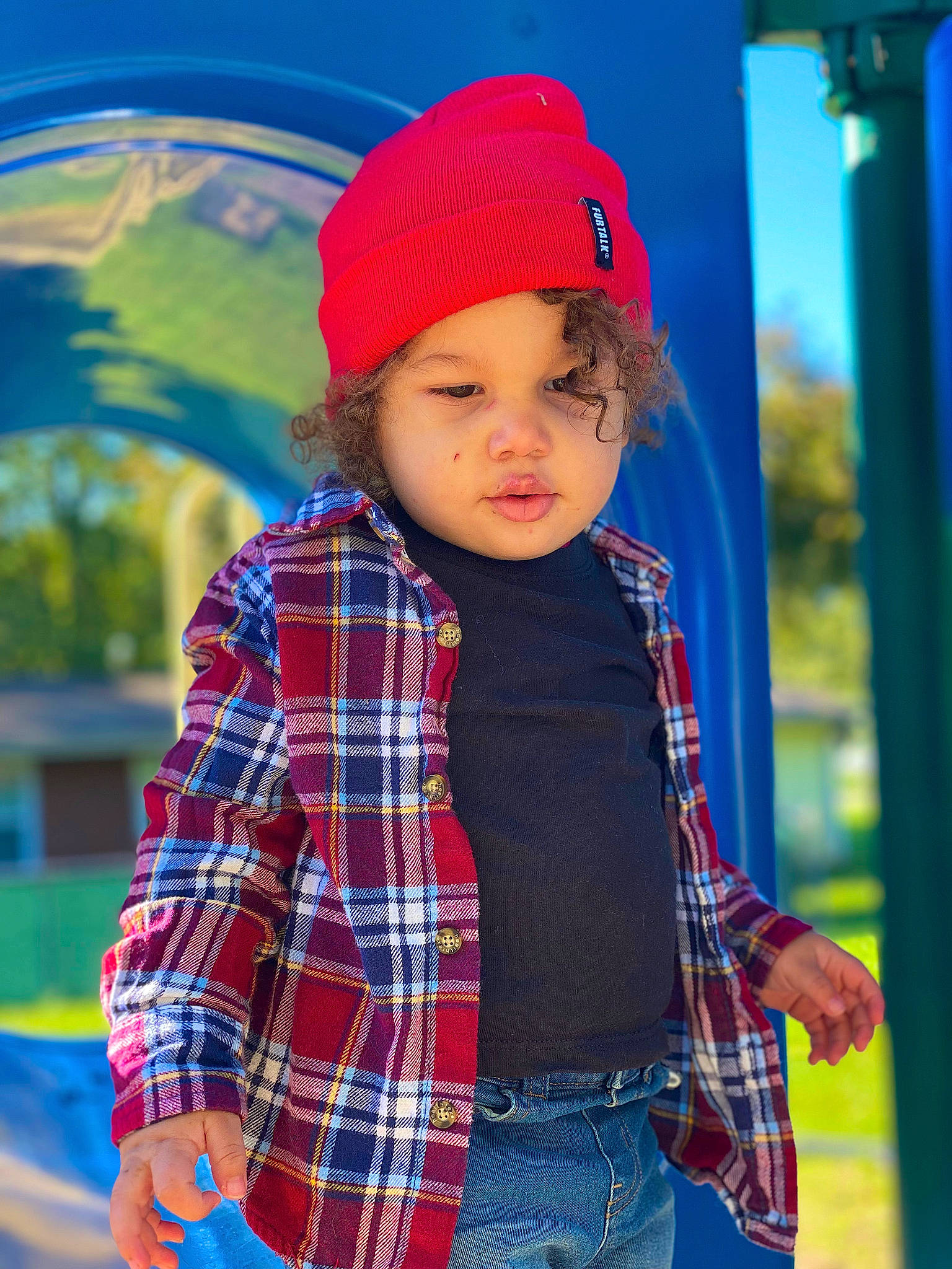 Lucas is registered to the contest to win money with this photo: blue, cap, cool, electric_blue, fun, happy, headgear, headwear, jeans, leisure, outerwear, people, person, plaid, public_space, red, sleeve, standing, tartan, textile