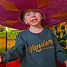 Liam joined the competition — help win amazing prizes! child, smiling, sombrero, pink_hat, blue_sweatshirt, jeans, cactus, colorful_background, red_bench, indoors, happy, portrait, casual_clothing, decor, playful, cute, kid, fun, hat, young