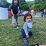 Chris is registered to the contest to win money with this photo: baby, blue_sky, casual, child, children, clothing, daylight, family, grass, greenery, nature, outdoor, park, people, picnic, play, shoes, summer, toy, trees