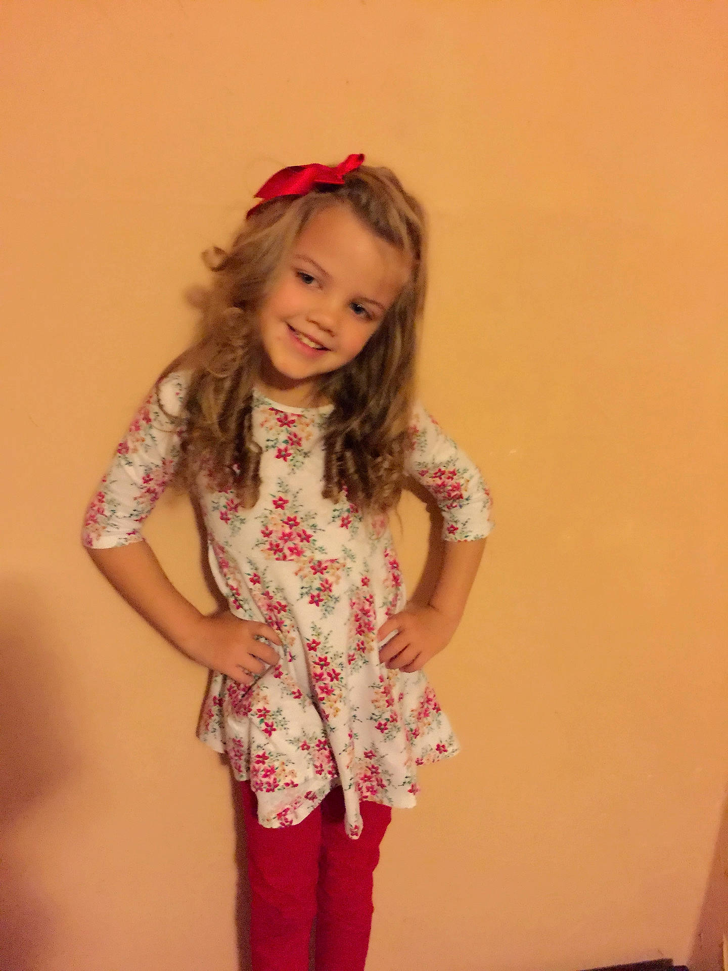 Emma Nevaeh is registered to the contest to win money with this photo: child, child_model, clothing, fashion_accessory, hair_accessory, joy, long_hair, person, pink, sleeve, smile, standing, toddler