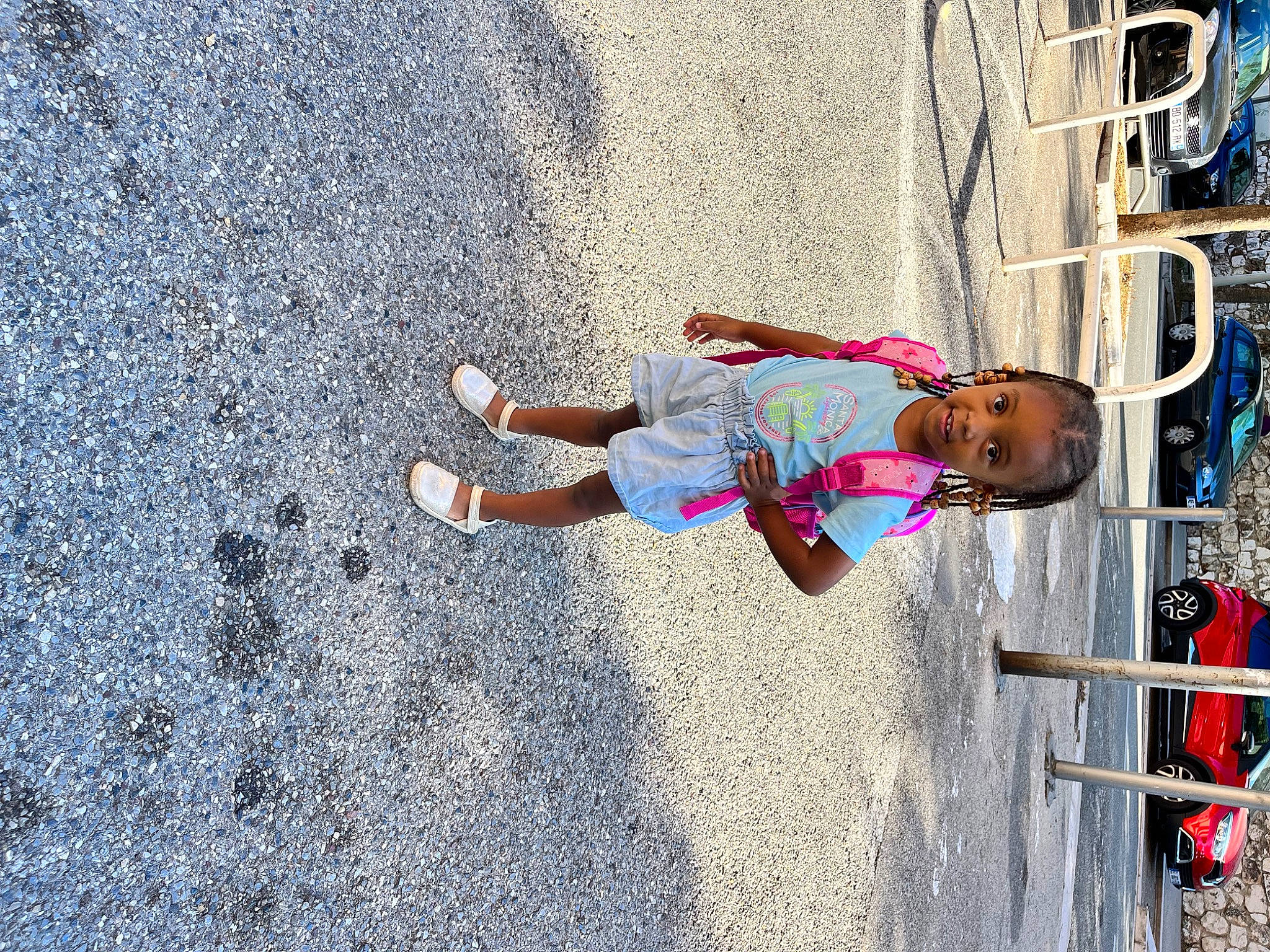 Bianca participe au concours pour gagner de l'argent avec cette photo : asphalt, blue, child, city, concrete, electric_blue, fun, leisure, pedestrian, person, play, recreation, road, road_surface, shadow, sidewalk, street, tar, tire, toddler