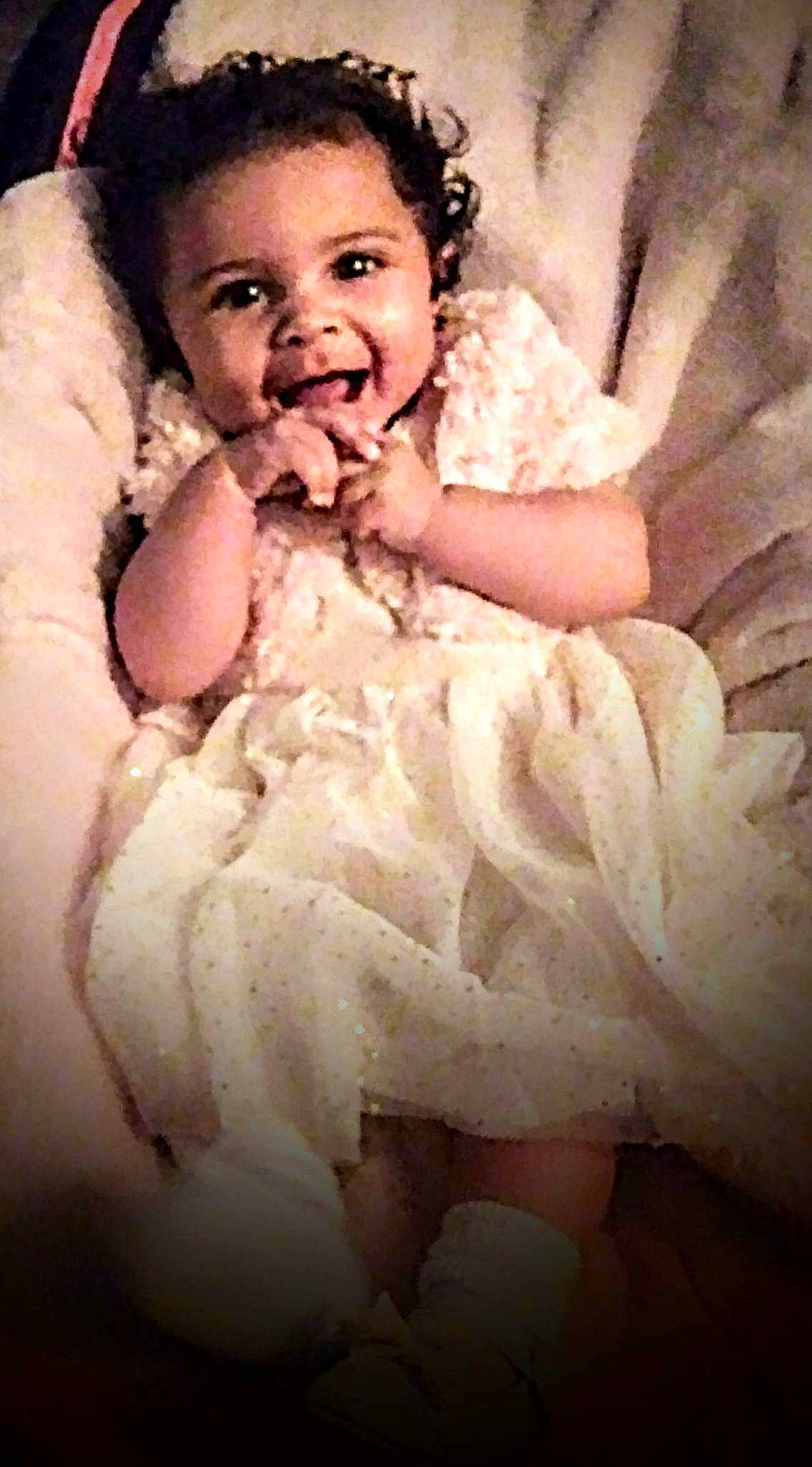 Ky-lea is registered to the contest to win money with this photo: baby, baby_toddler_clothing, cheek, child, comfort, event, flash_photography, fun, gesture, happy, linens, lip, nail, peach, person, portrait, skin, sleeve, smile, thumb