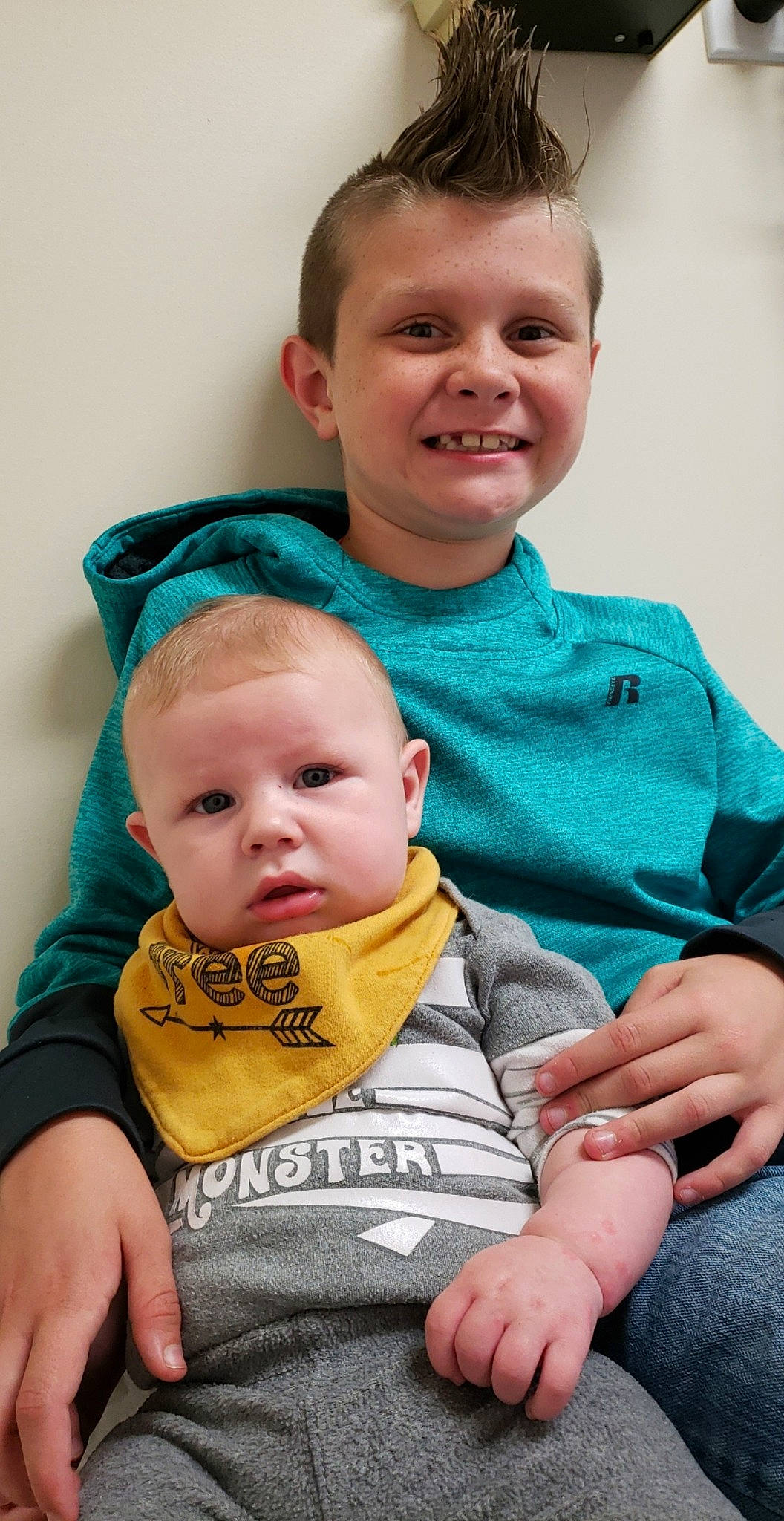 Ty is registered to the contest to win money with this photo: baby, cheek, child, father, joy, male, people, person, sibling, sitting, smile, toddler