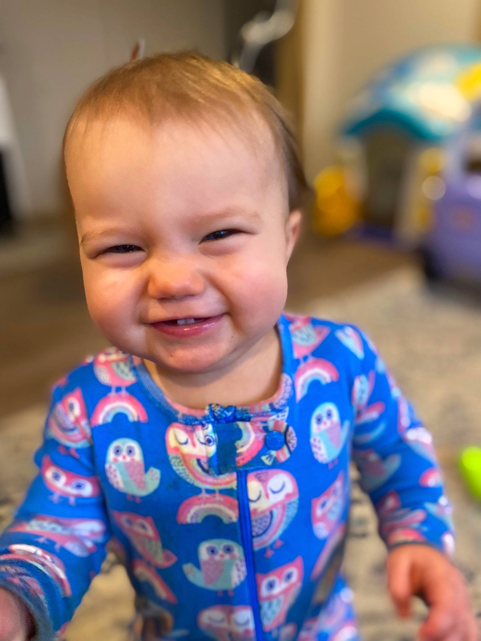 Ella is registered to the contest to win money with this photo: baby, baby_toddler_clothing, cheek, child, chin, face, flooring, fun, hairstyle, happy, iris, joy, nose, person, play, sitting, skin, sleeve, smile, t_shirt