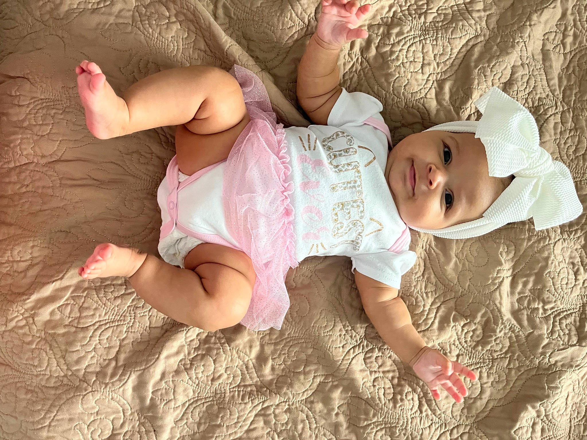 Marianna is registered to the contest to win money with this photo: baby, baby_toddler_clothing, beauty, child, comfort, eye, finger, foot, fun, grass, happy, head, headgear, headwear, human_body, people, person, pink, skin, sleeve