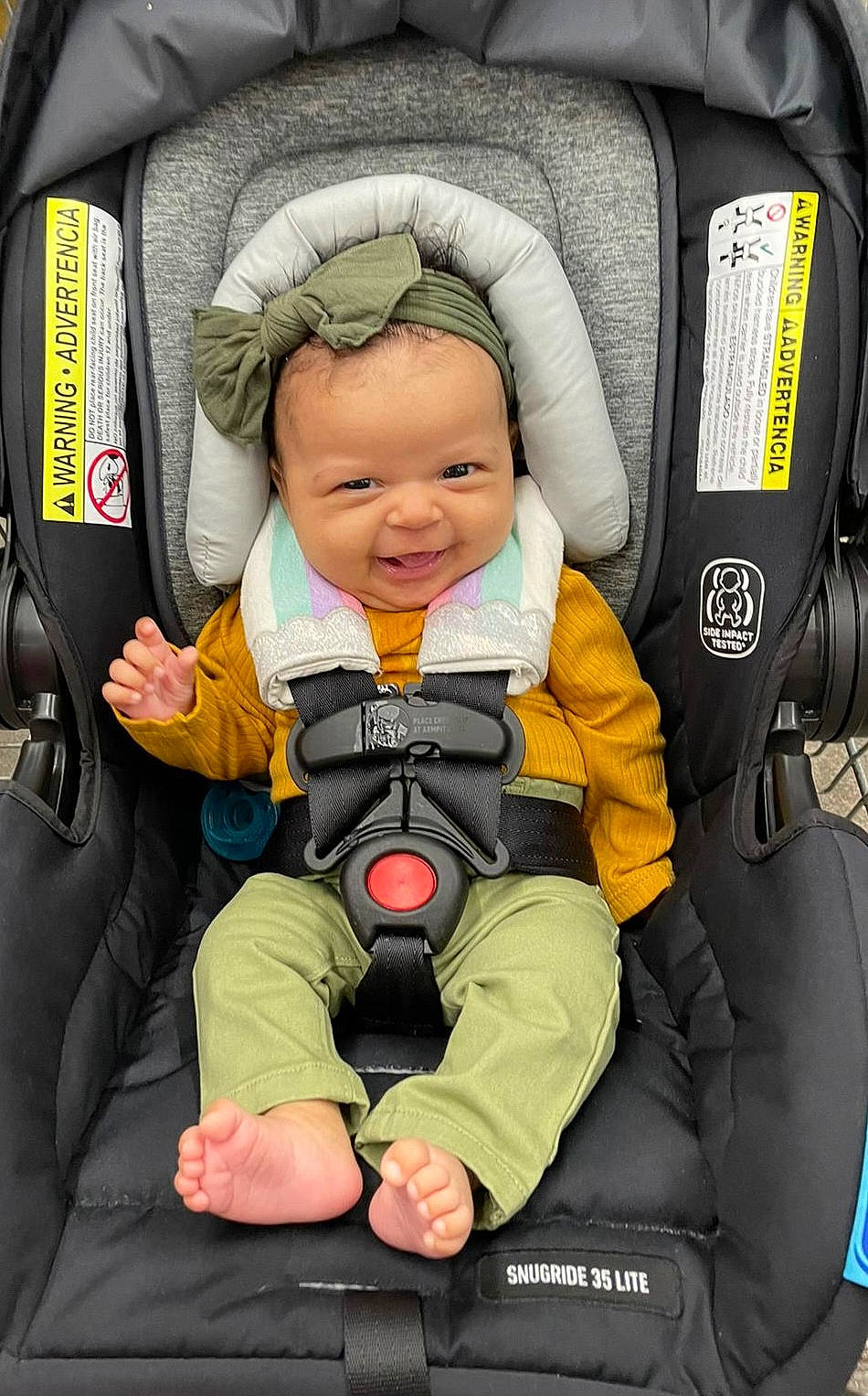 Marianna is registered to the contest to win money with this photo: auto_part, baby, baby_carriage, baby_in_car_seat, baby_products, baby_safety, baby_toddler_clothing, car_seat, child, comfort, person, personal_protective_equipment, photograph, seat_belt, service, sitting, smile, thumb, toddler, travel