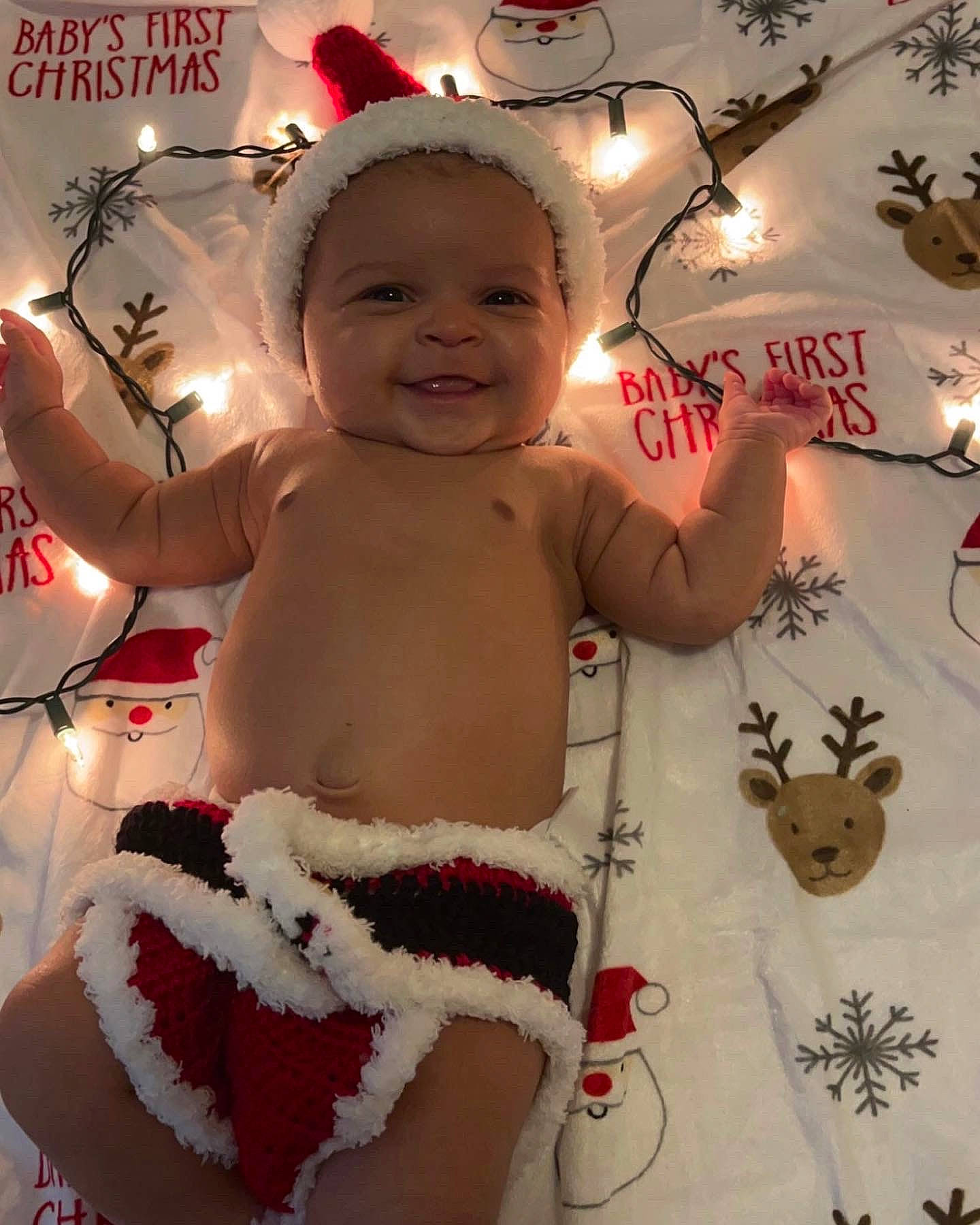 Marianna joined the competition — help win amazing prizes! baby, baby_toddler_clothing, child, christmas_eve, christmas_ornament, event, finger, happy, head, holiday, human_body, joy, mammal, person, photograph, pink, red, skin, smile, standing