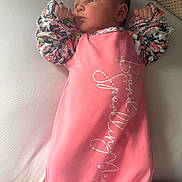 Haven is registered to the contest to win money with this photo: baby, bed, child, clothing, cute, face, floral, hands, indoors, infant, lying, newborn, person, pillow, pink, portrait, resting, skin, sleepwear, soft