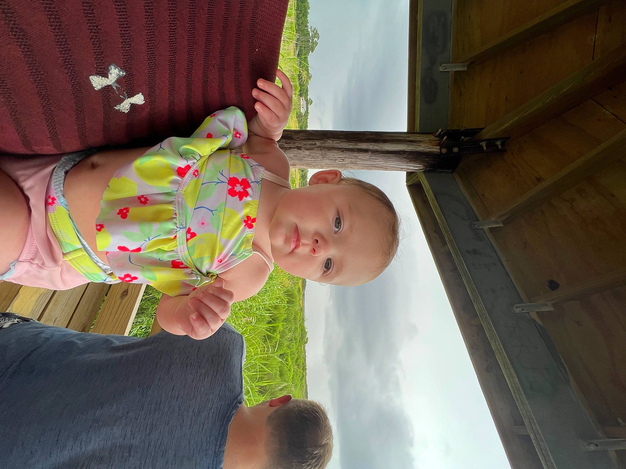 Ashlyn is registered to the contest to win money with this photo: baby, baby_products, baby_toddler_clothing, child, dress, fun, happy, hat, human_leg, pattern, person, plant, skin, sky, smile, thigh, toddler, tree, trunk, window