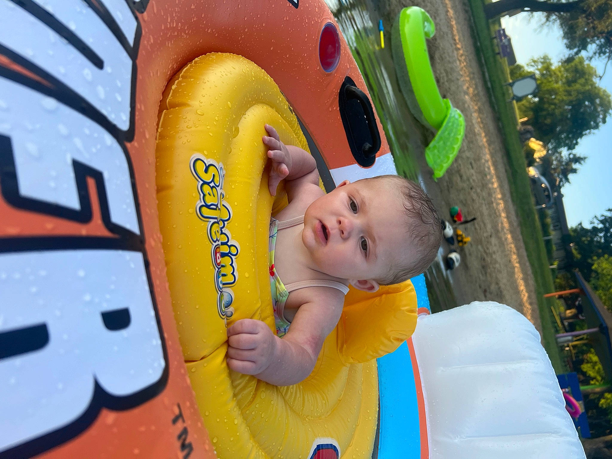 Ashlyn joined the competition — help win amazing prizes! baby, baby_toddler_clothing, child, chute, city, fun, grass, happy, inflatable, leisure, outdoor_play_equipment, person, photograph, plant, playground, recreation, sky, toddler, tree, world
