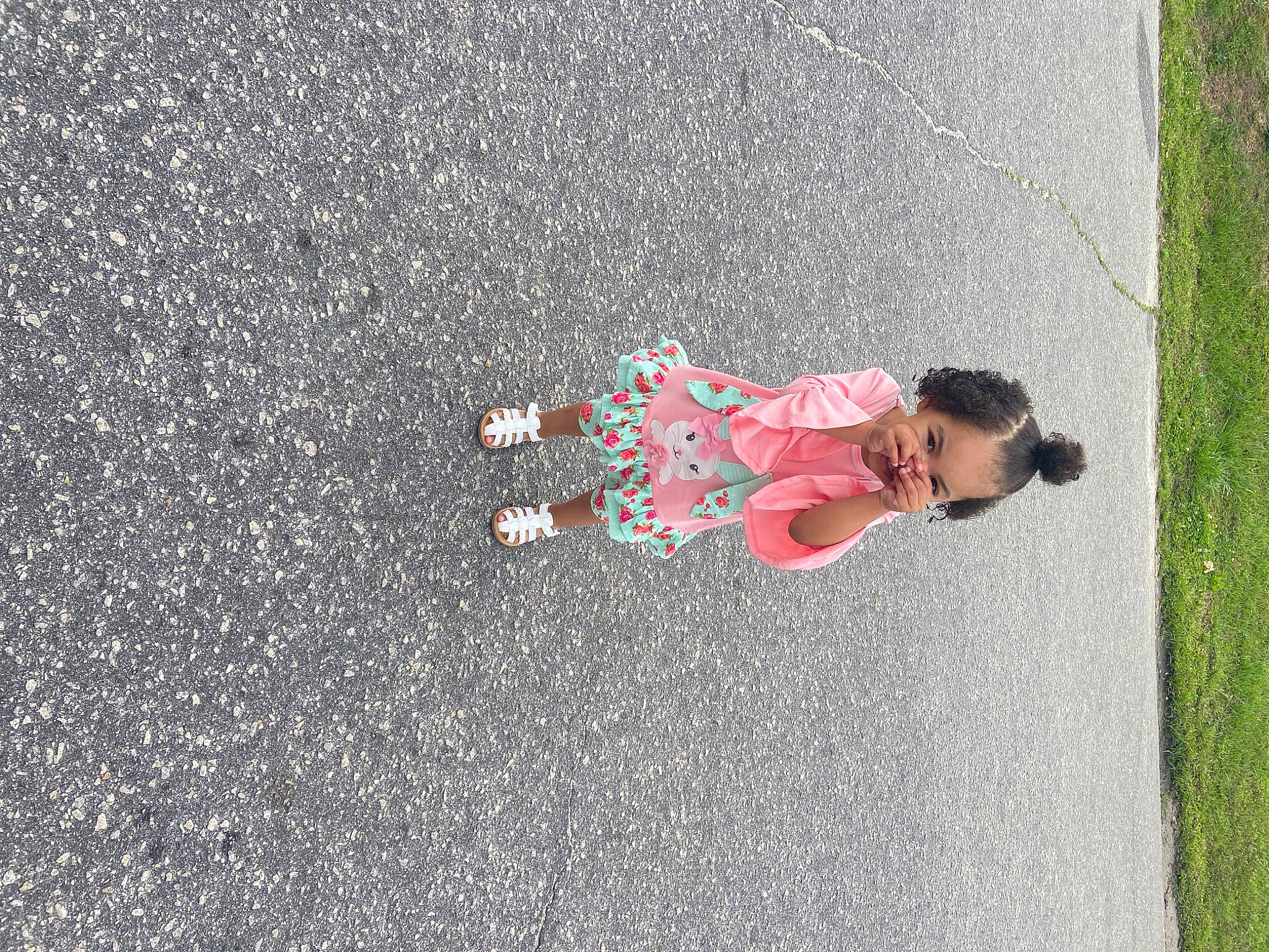 London is registered to the contest to win money with this photo: asphalt, child, concrete, fun, grass, leisure, pedestrian, person, plant, recreation, road, road_surface, shadow, sidewalk, soil, street, sunglasses, tar, toddler, tree