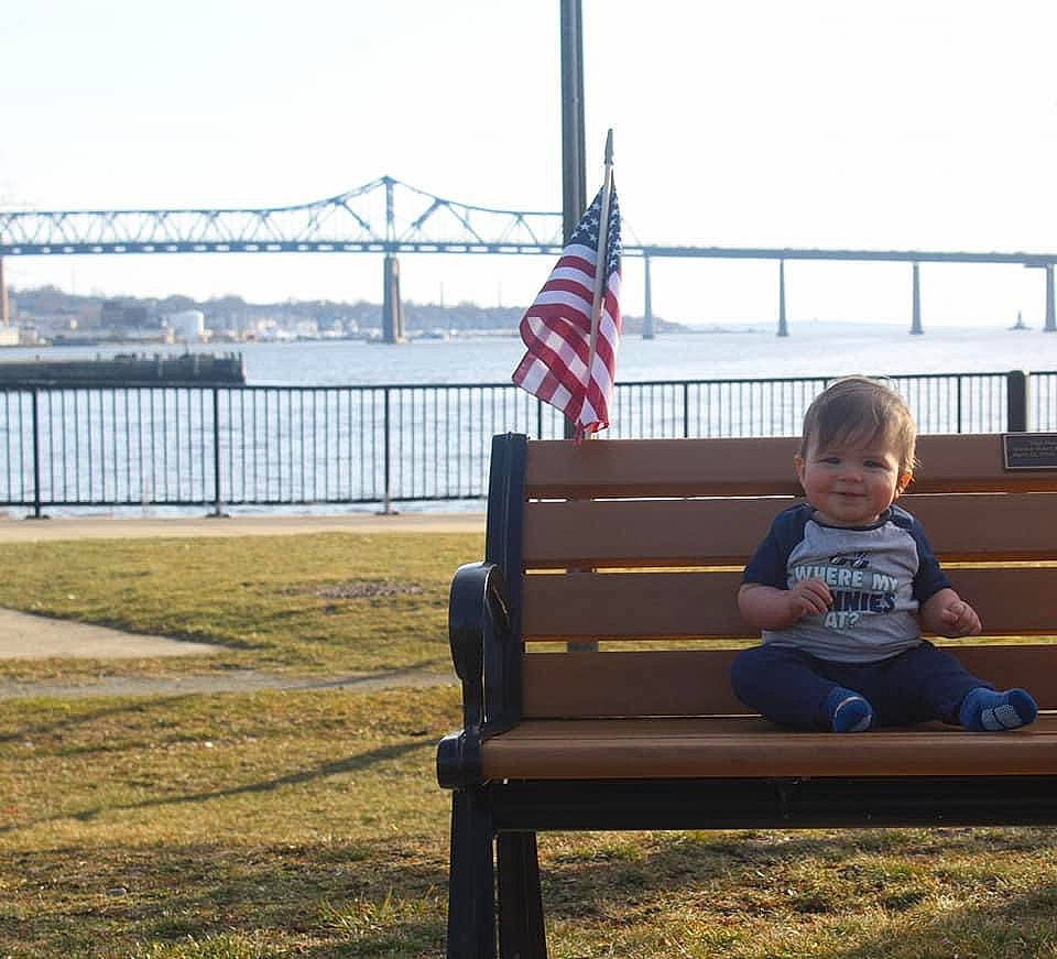Sheamus joined the competition — help win amazing prizes! bench, city, comfort, fence, flag, flag_of_the_united_states, grass, joy, lake, leisure, line, outdoor_bench, outdoor_furniture, person, recreation, sitting, sky, street_furniture, toddler, travel