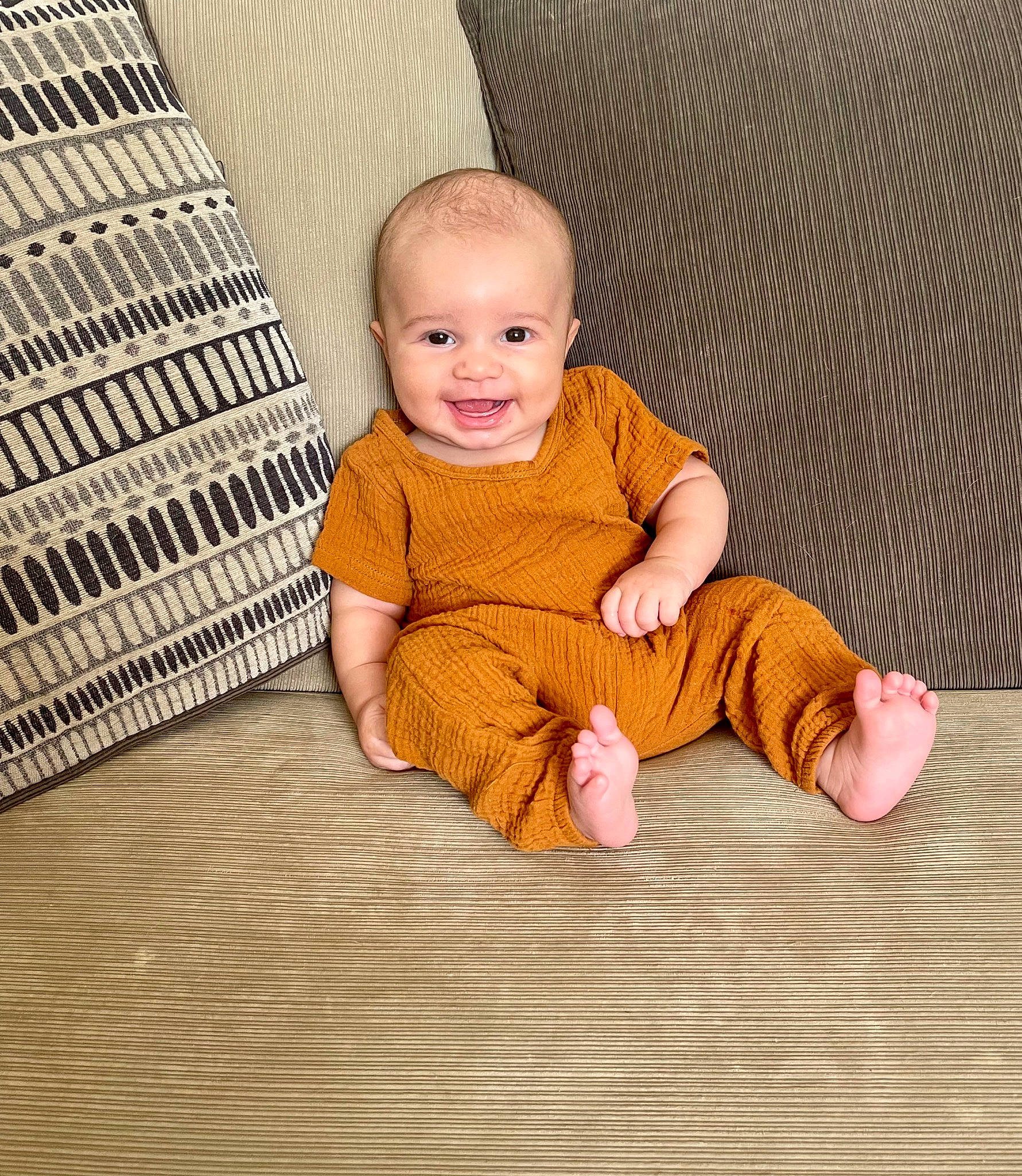 Jamari is registered to the contest to win money with this photo: baby, baby_toddler_clothing, cheek, child, comfort, crawling, floor, flooring, foot, fun, happy, hardwood, joy, nose, pattern, person, sitting, sleeve, smile, toddler