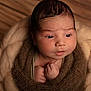 Numa participe au concours pour gagner de l'argent avec cette photo : newborn, baby, infant, wrapped, blanket, soft, cozy, face, portrait, cute, skin, hands, expression, indoors, warm, knit, wood, texture, closeup, peaceful